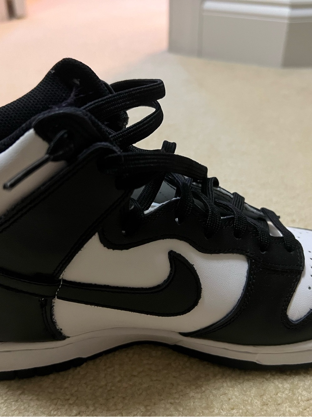 Nike Women's Black and White High-Top Sneakers